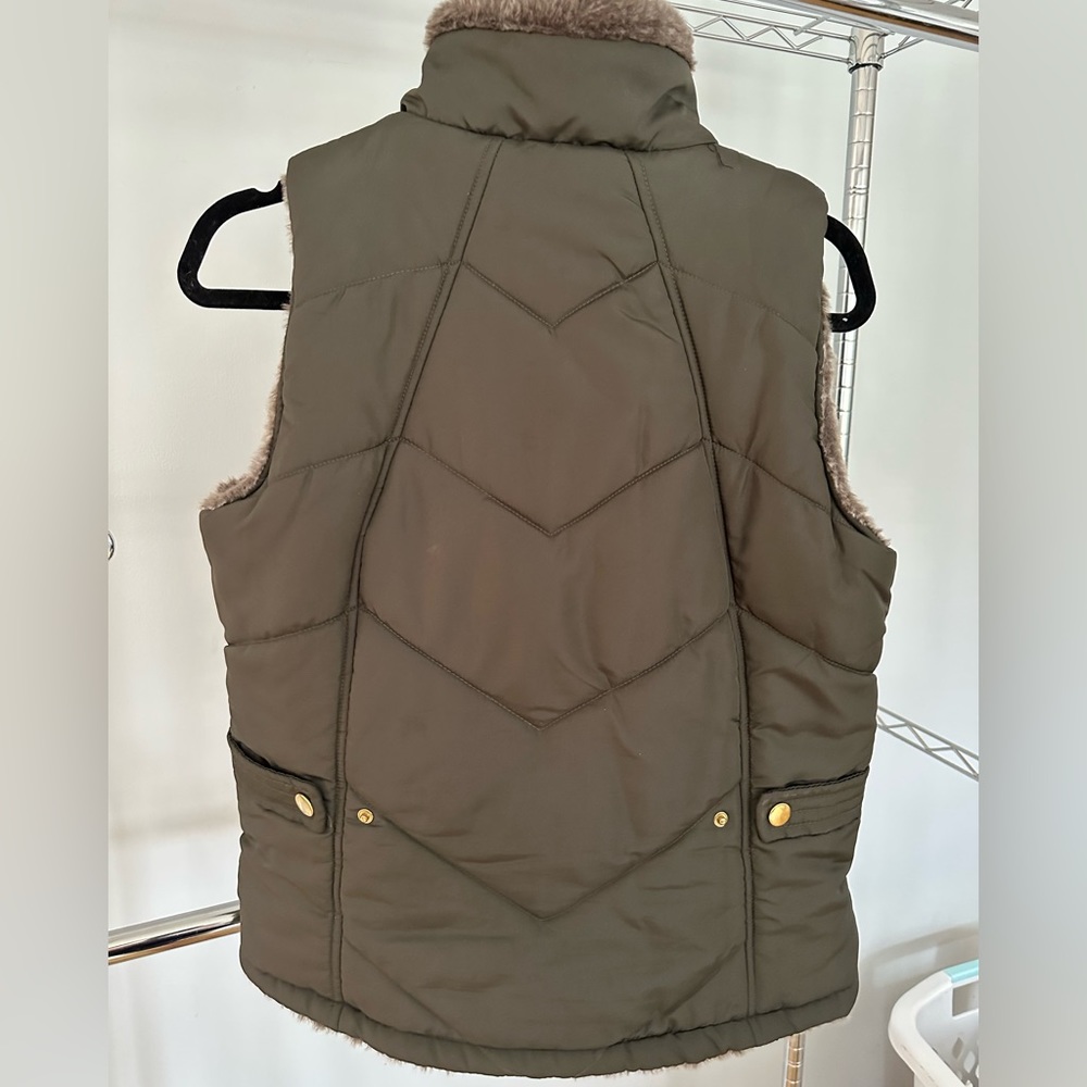 Small adjustable faux fur lined vest brand new condition
